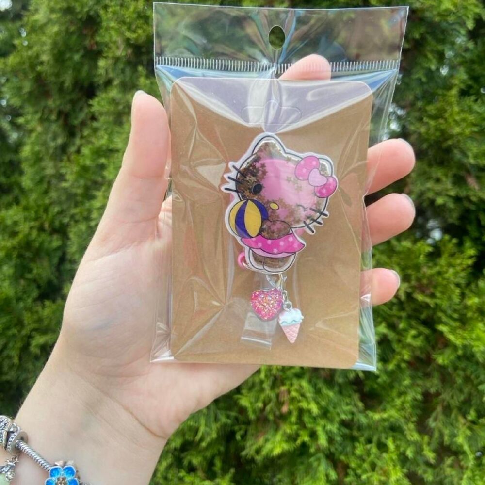 Brown/Pink Hello Kitty Shaker Badge Reel